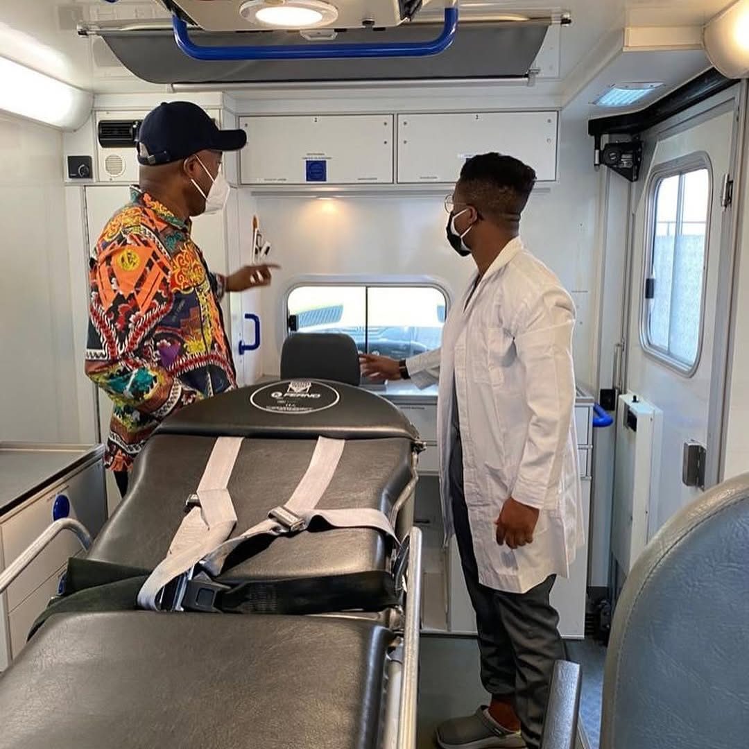 Inspecting the mobile ICU ambulance interior with the Paelon Hospital team